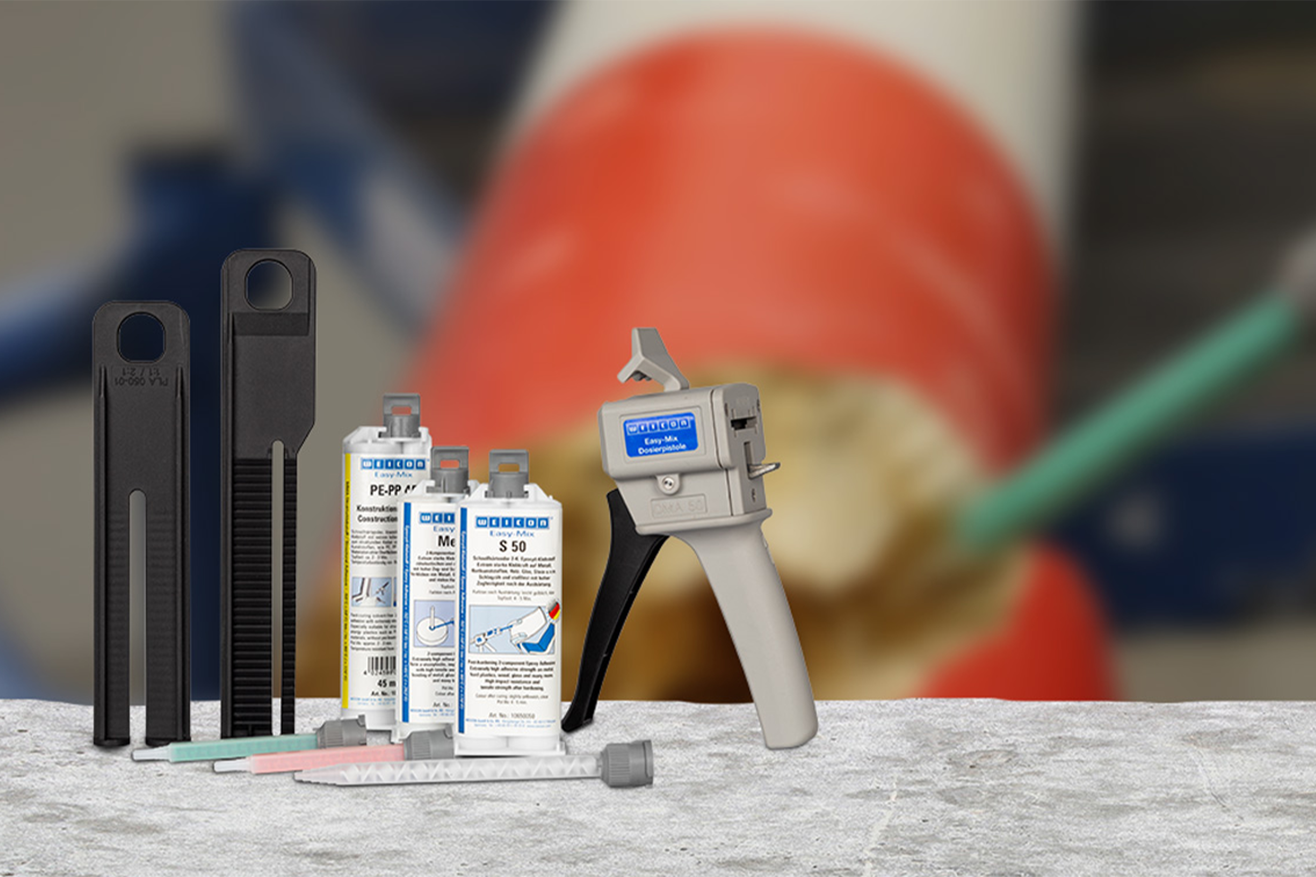 Sistem WEICON Easy-Mix dengan pistol pengukur, kartrid lem, dan perlengkapan
