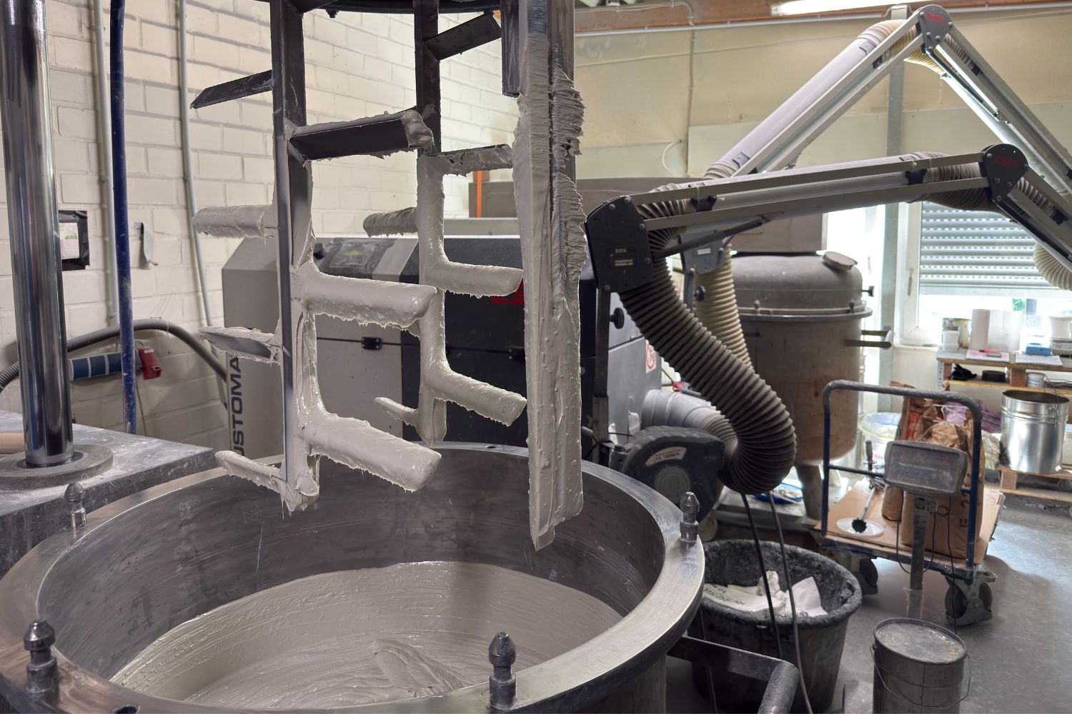 Large machine containing white adhesive